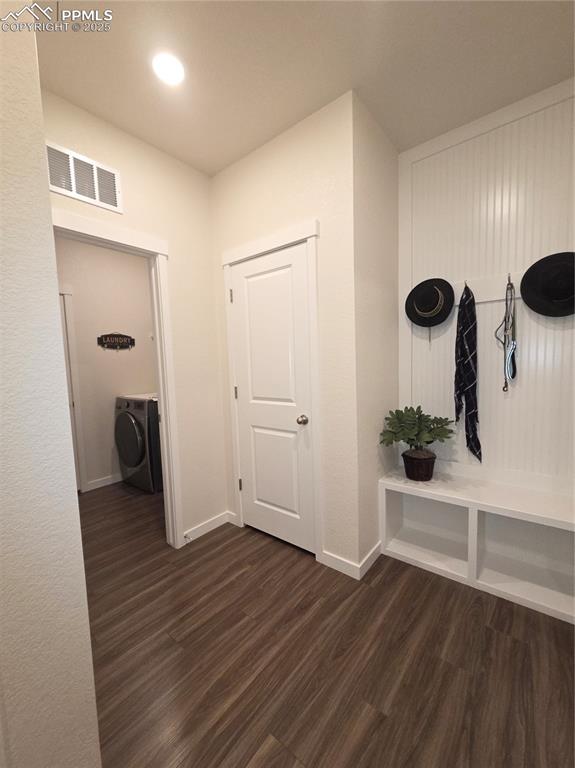 Image 23 of 42: Mudroom featuring washer / dryer and dark wood-type flooring