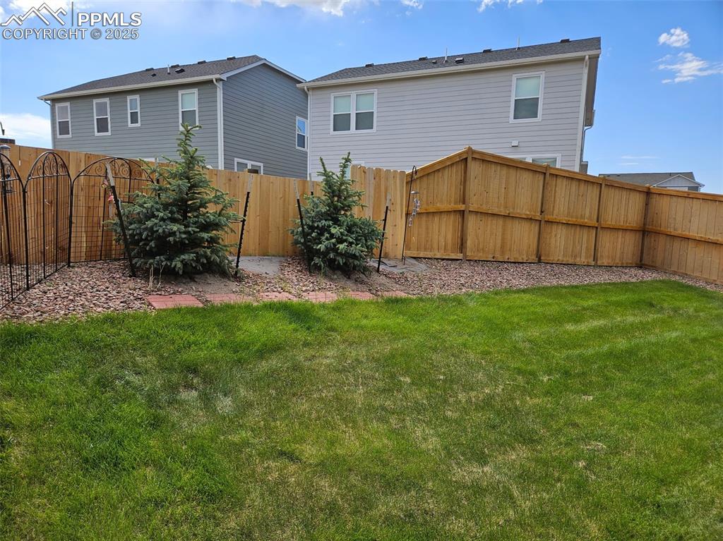 Image 39 of 42: View of fenced backyard
