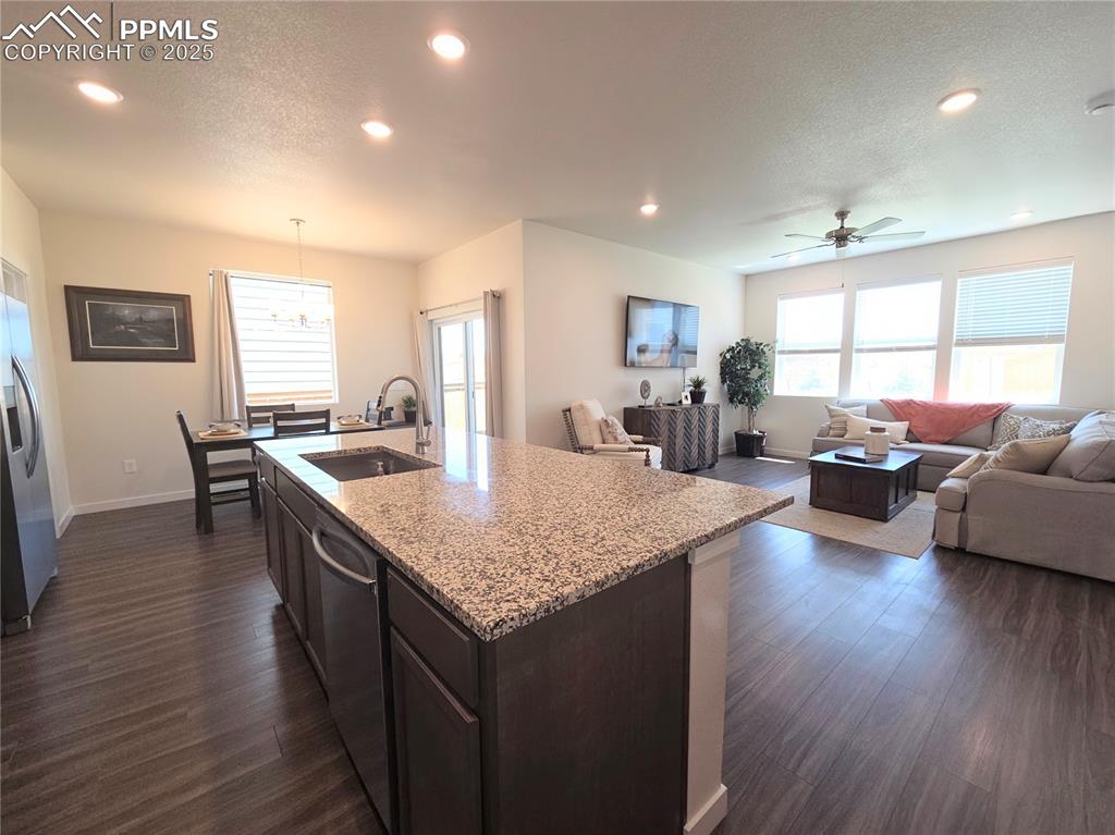 Image 4 of 42: Kitchen featuring plenty of natural light, recessed lighting, dark wood-typ