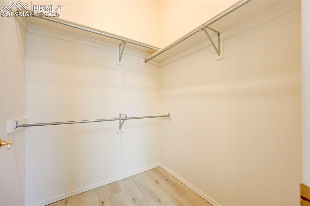 Image 21 of 45: Main level primary bedroom walk in closet