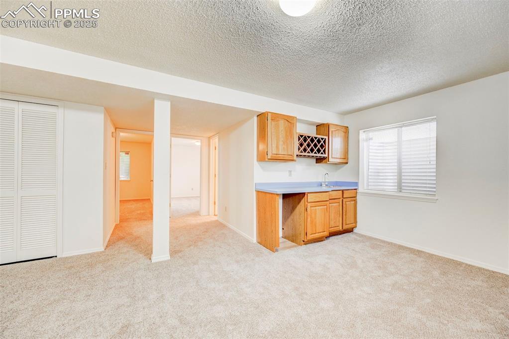 Image 30 of 45: Basement wet bar