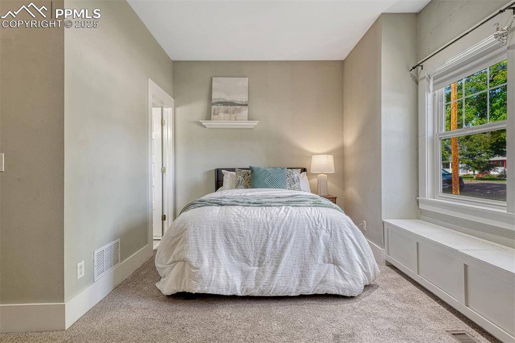 Image 13 of 42: main level bedroom