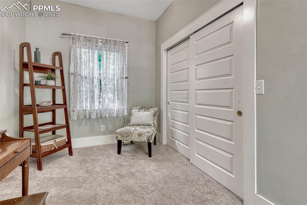 Image 14 of 42: main level bedroom - sitting area