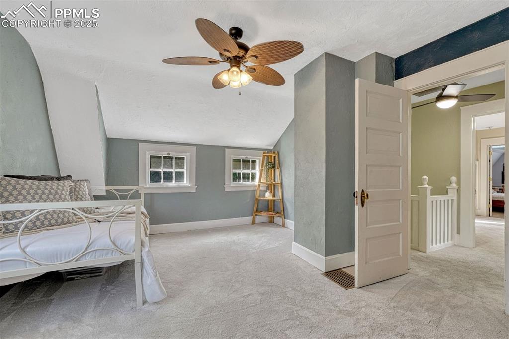 Image 33 of 42: secondary upstairs bedroom with walk in closet