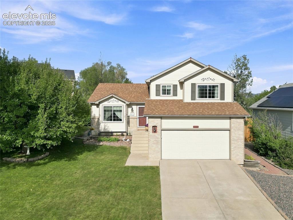 Image 42 of 45: Front of house with 2 car garage