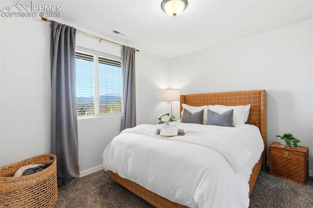 Image 36 of 49: Guest bedroom bottom floor