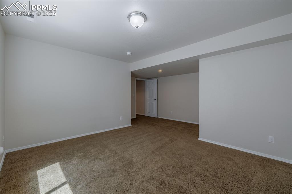 Image 39 of 50: Carpeted room featuring a ceiling fan with integrated lighting, two recesse