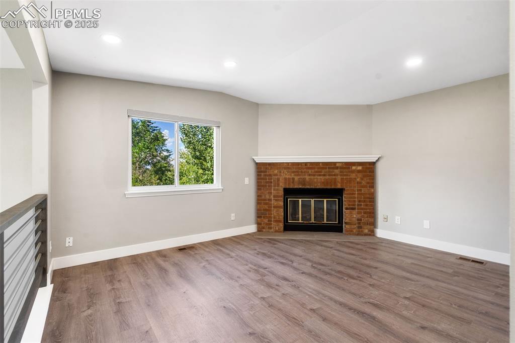 Image 16 of 29: upper level w/ fireplace