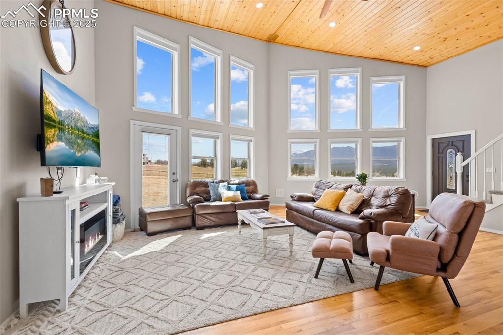 Image 13 of 48: View from the dining space looking toward the front door showing the large 