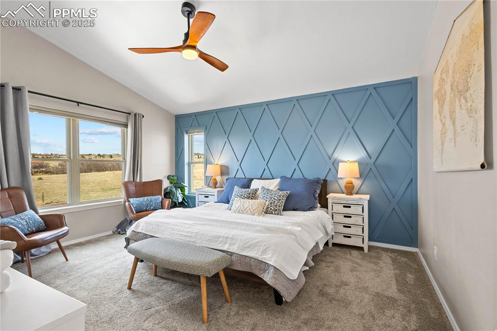 Image 16 of 48: Master suite bedroom has vaulted ceilings, fan, and connects to the 5 piece