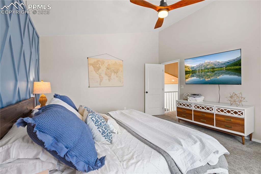 Image 17 of 48: Another view of the master bedroom with door to the hallway.