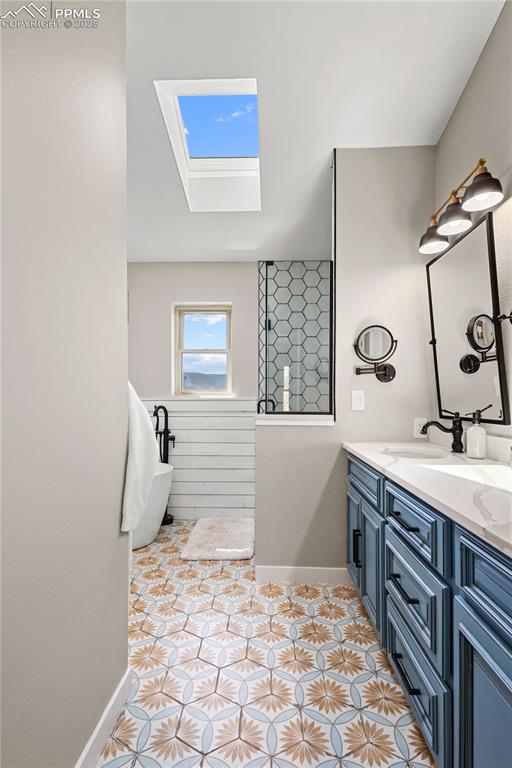 Image 18 of 48: Heading into the primary bathroom with double vanities and luxurious shower