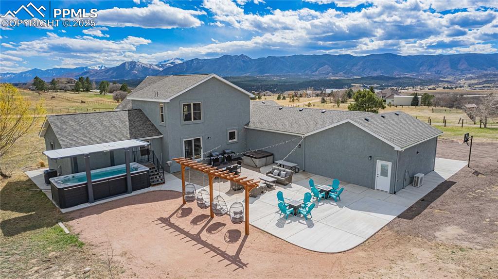 Image 2 of 48: Backyard was made for entertaining with swim pool, swing set and large pati