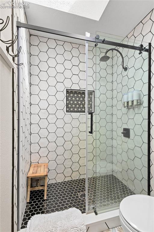 Image 25 of 48: Beautiful walk-in shower in main level 3/4 bathroom