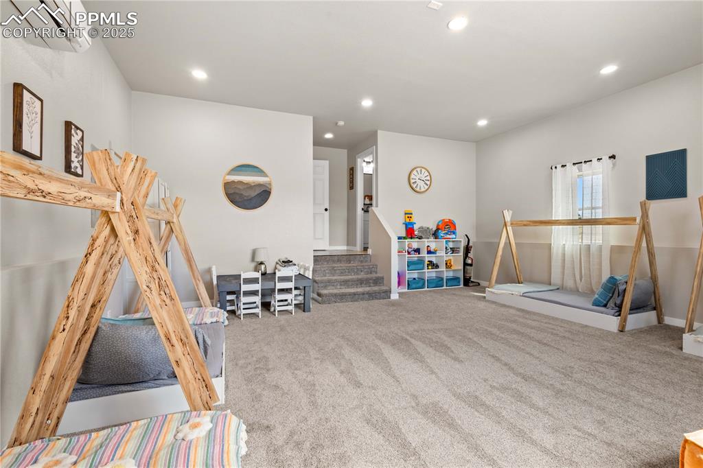 Image 26 of 48: Recently added bonus room featuring carpet floors and an AC wall unit. Bonu