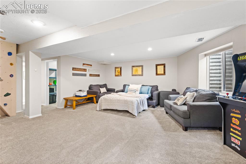 Image 29 of 48: Family Room featuring carpet, climbing wall, and lots of space for fun.