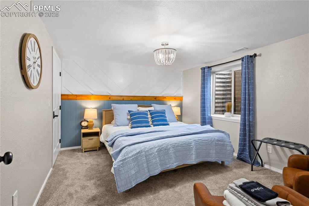 Image 33 of 48: Fourth bedroom is located in the basement next to the 3/4 bathroom.