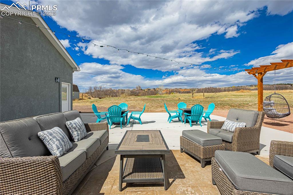 Image 36 of 48: Fun back yard space...all patio furniture and fire pit could be included. 
