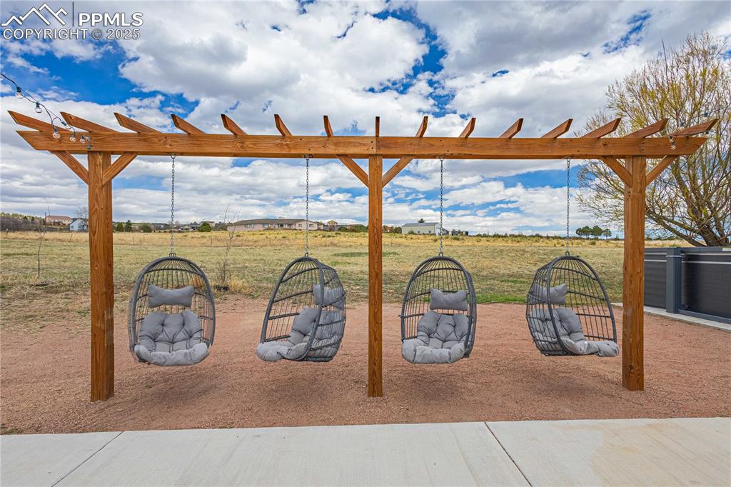 Image 39 of 48: Check this out...even big people like to swing!