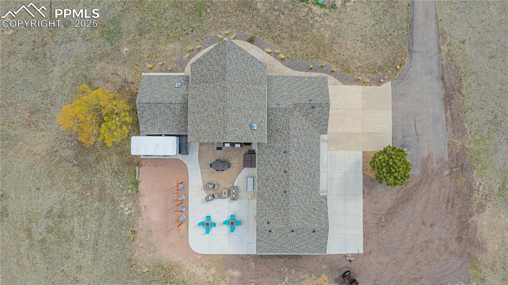 Image 40 of 48: Aerial view showing all the parking options on the right said of the home a