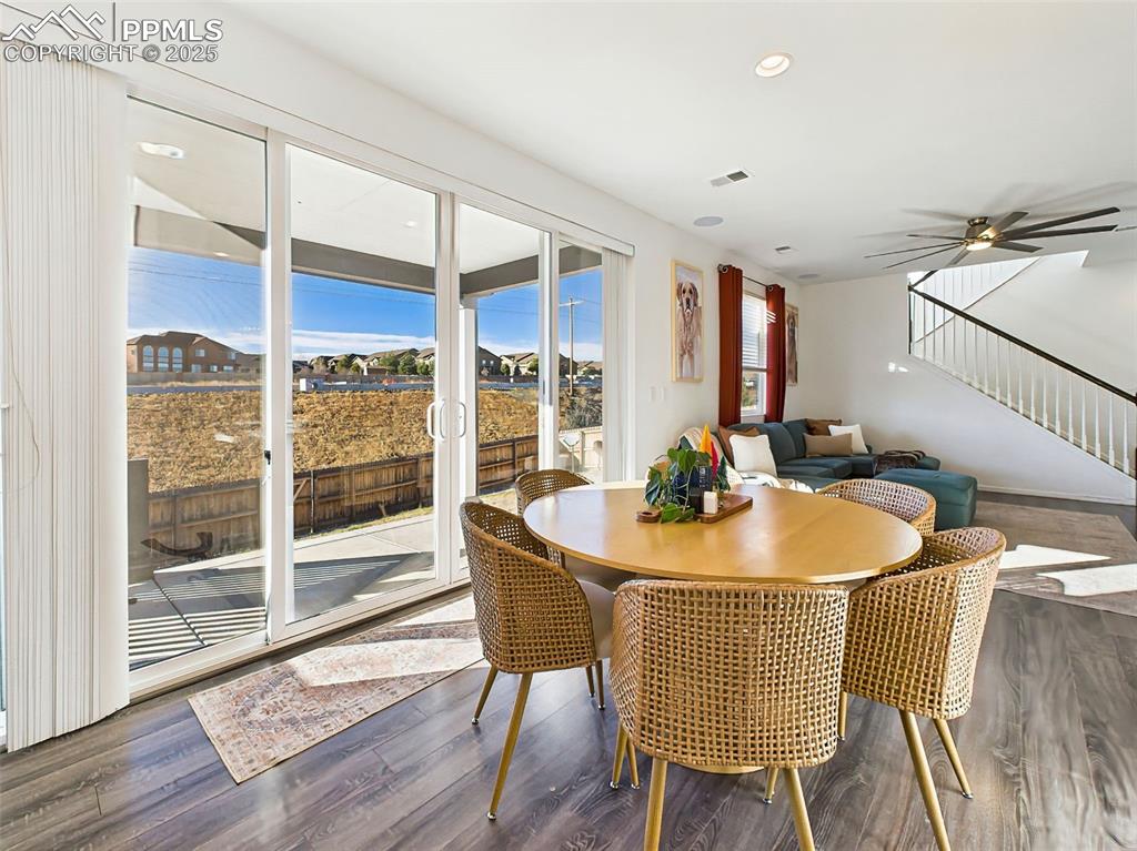 Image 13 of 50: Enjoy easy indoor-outdoor flow from the central dining space, ideal for ent