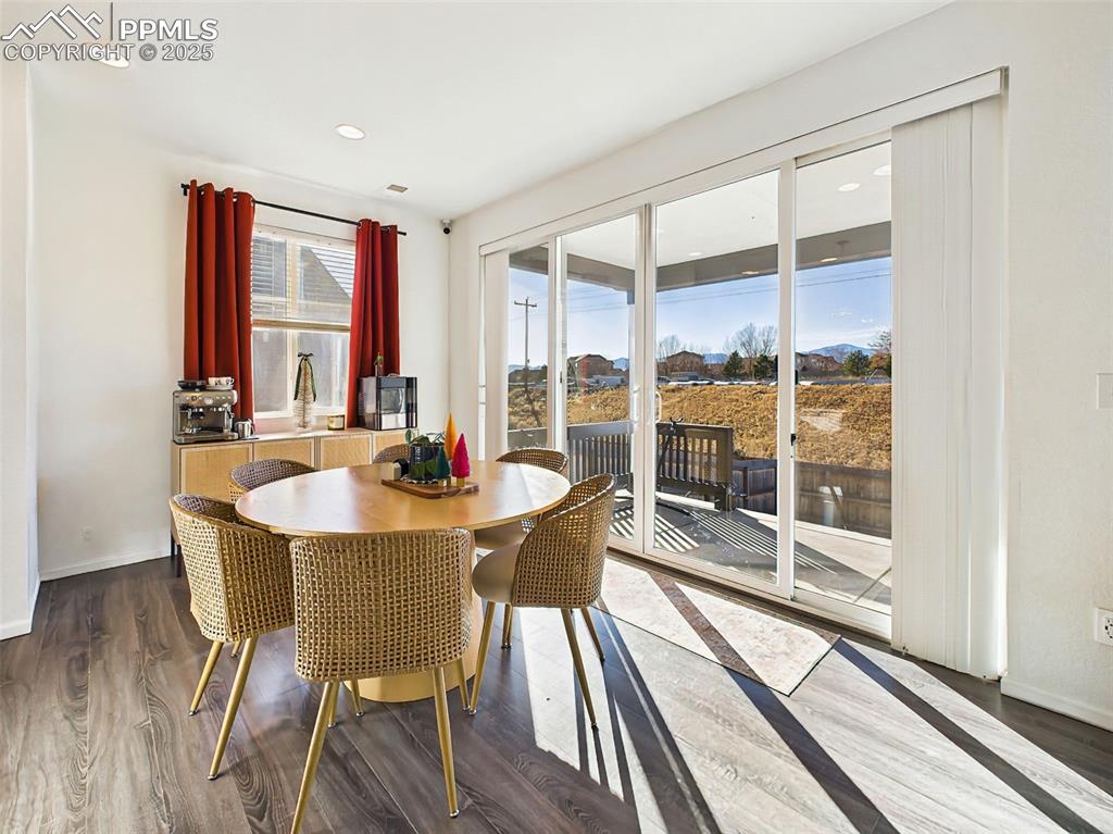 Image 14 of 50: Light-filled dining area with direct access to the backyard via an 11’6” wi