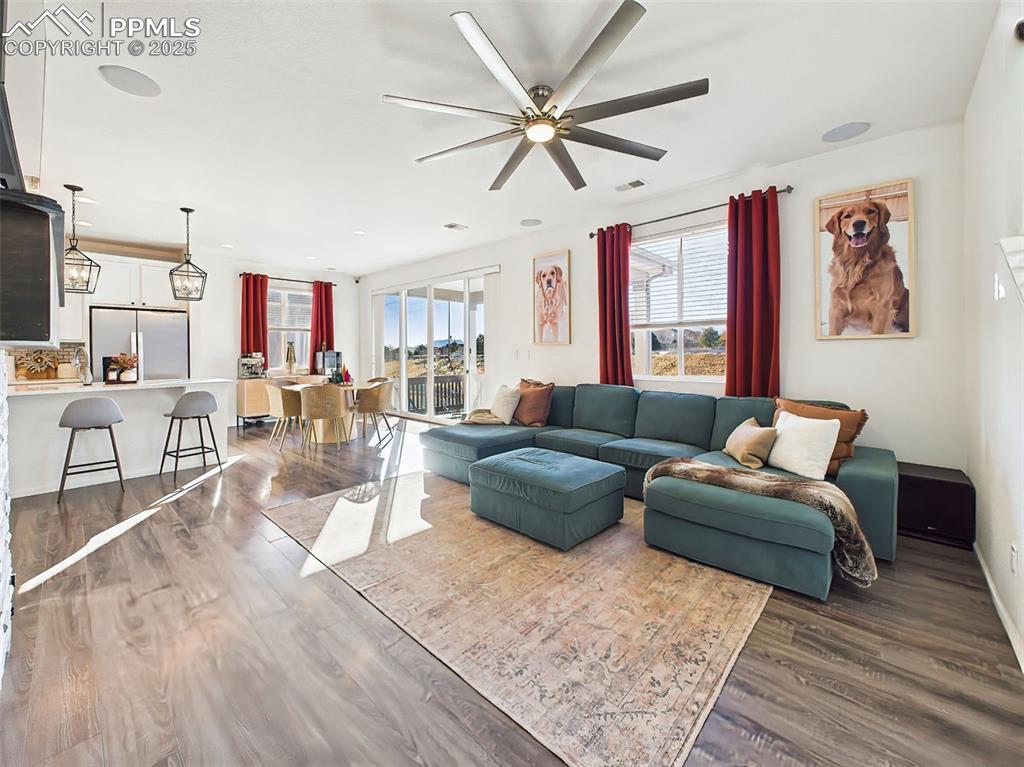 Image 17 of 50: Expansive living space with oversized windows and easy access to the kitche