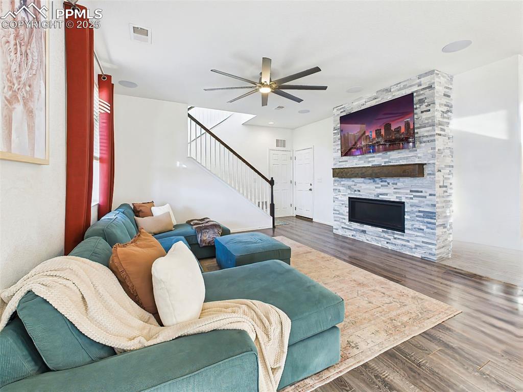 Image 19 of 50: Open layout with upgraded stair railings and wide-plank flooring, perfect f