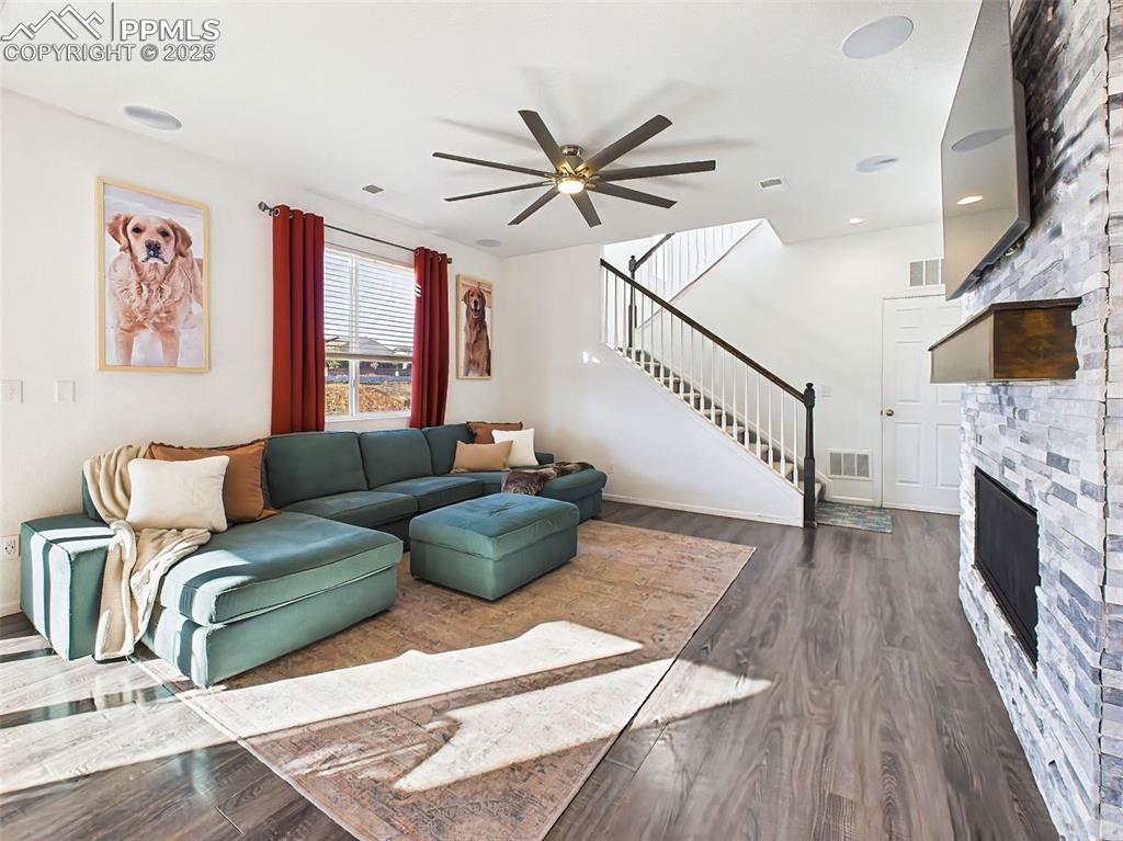 Image 21 of 50: Another angle of the spacious great room with wide-plank flooring, ceiling 