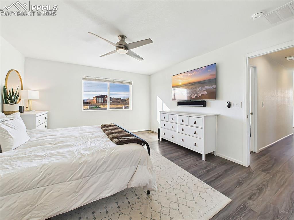 Image 28 of 50: Another look at the spacious primary bedroom, complete with neutral tones a