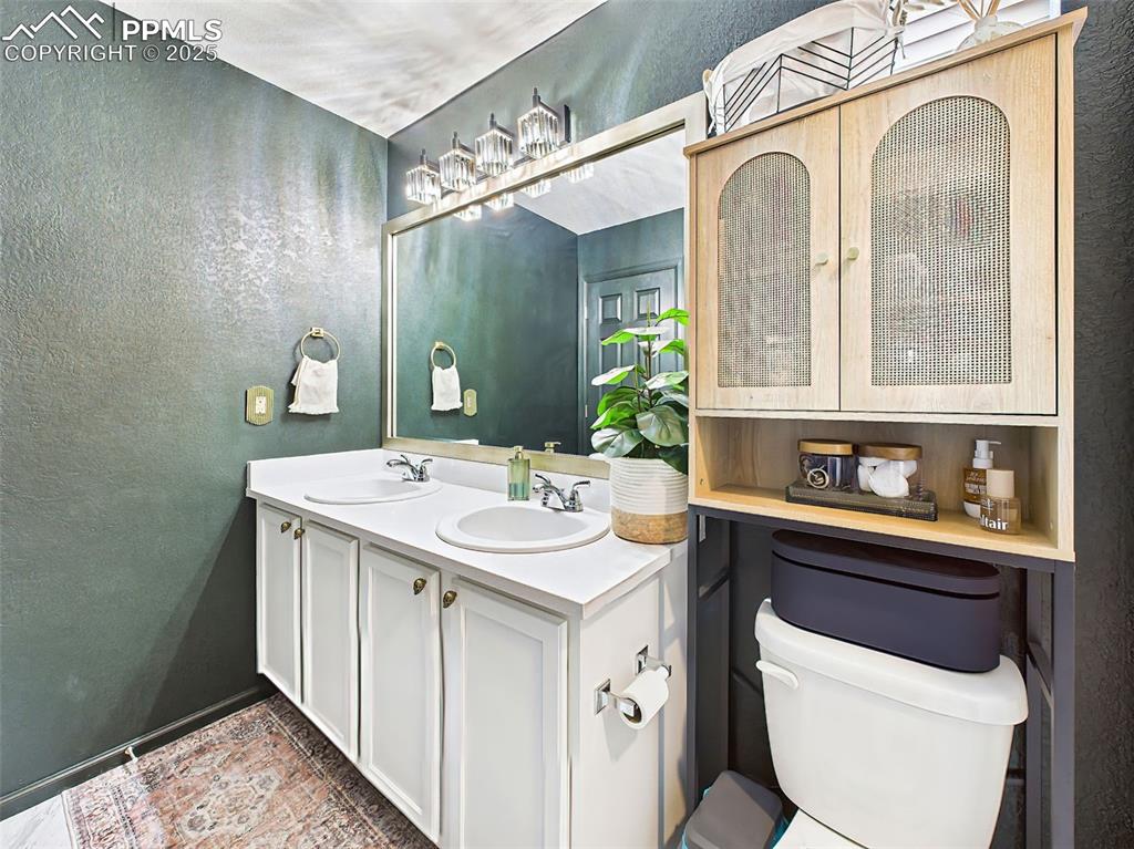 Image 39 of 50: Second angle reveals sleek storage and gold-accented fixtures — a unique bl