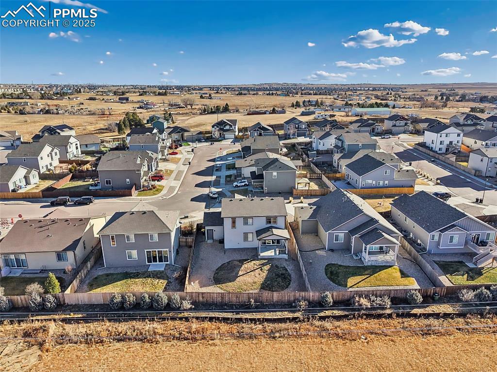 Image 48 of 50: Drone view shows this home’s placement within Mountain Valley Preserve and 