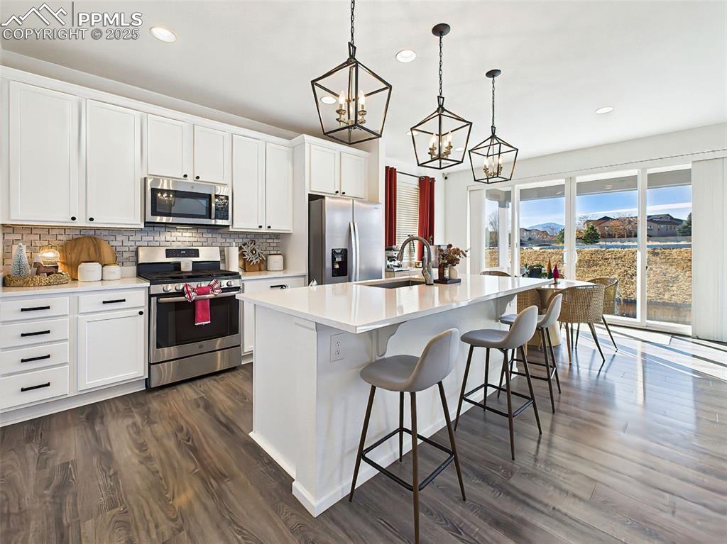 Image 6 of 50: Extended cabinetry and generous countertop space highlight the thoughtful d