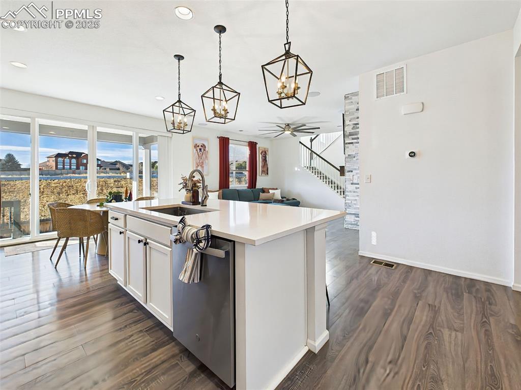 Image 9 of 50: The open-concept layout flows seamlessly into the great room, enhanced by w