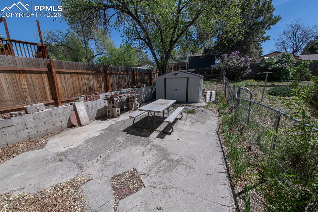 Image 32 of 41: Back concrete patio