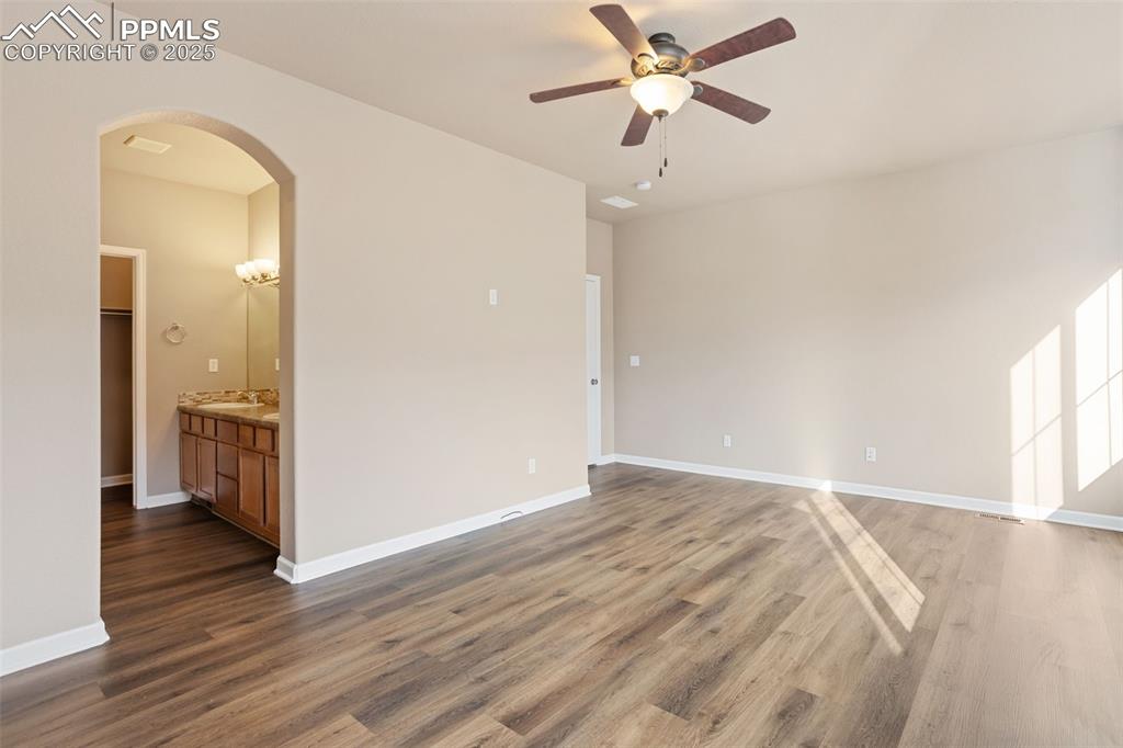 Image 15 of 30: Upper hallway going toward secondary suite.