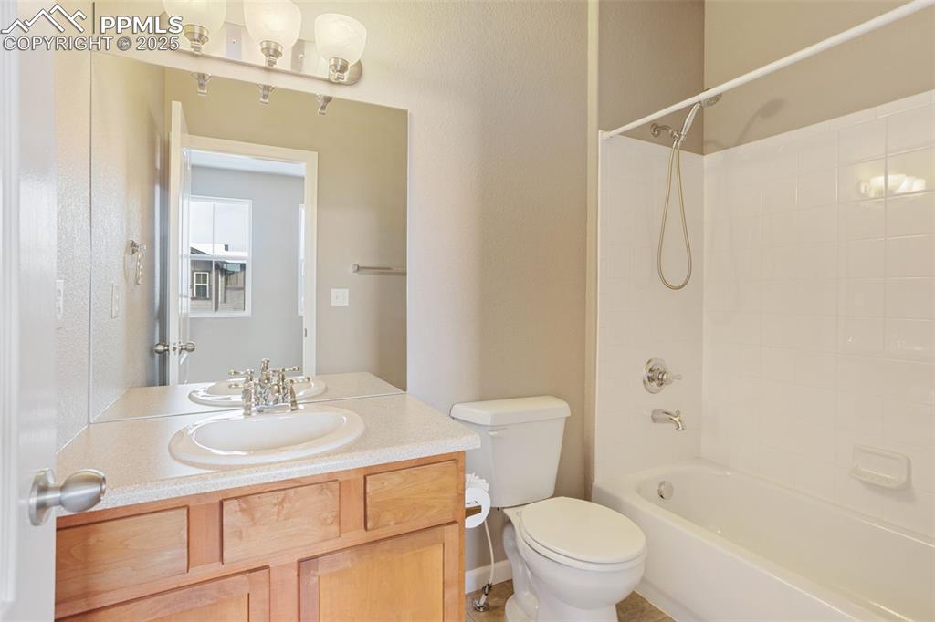 Image 22 of 30: Full bath, attached to bedroom 2.