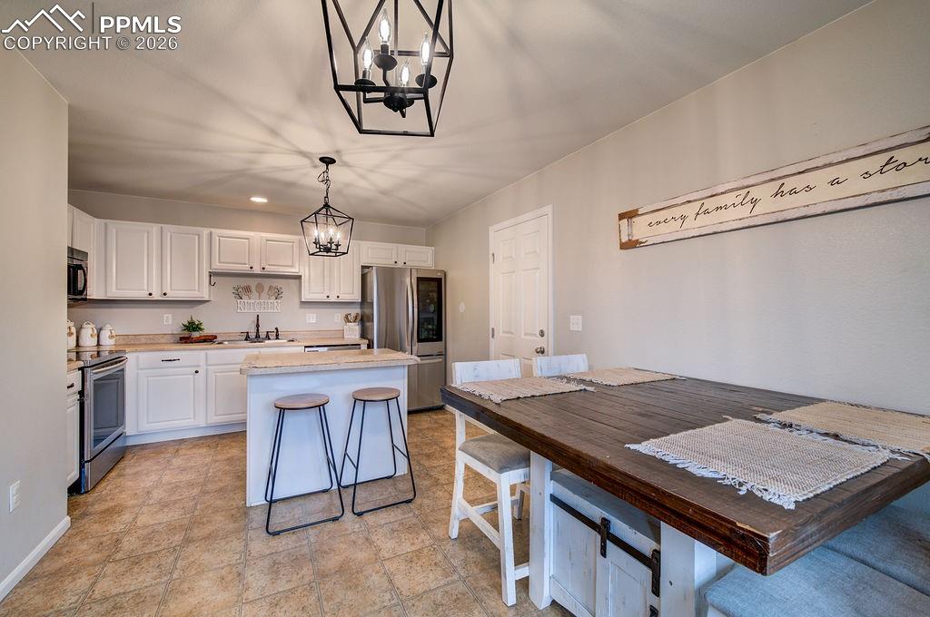 Image 11 of 48: The Dining Area is located off the Kitchen making it easy for food service