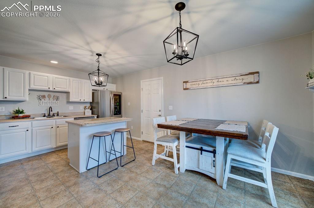 Image 12 of 48: Dining Area and Kitchen.