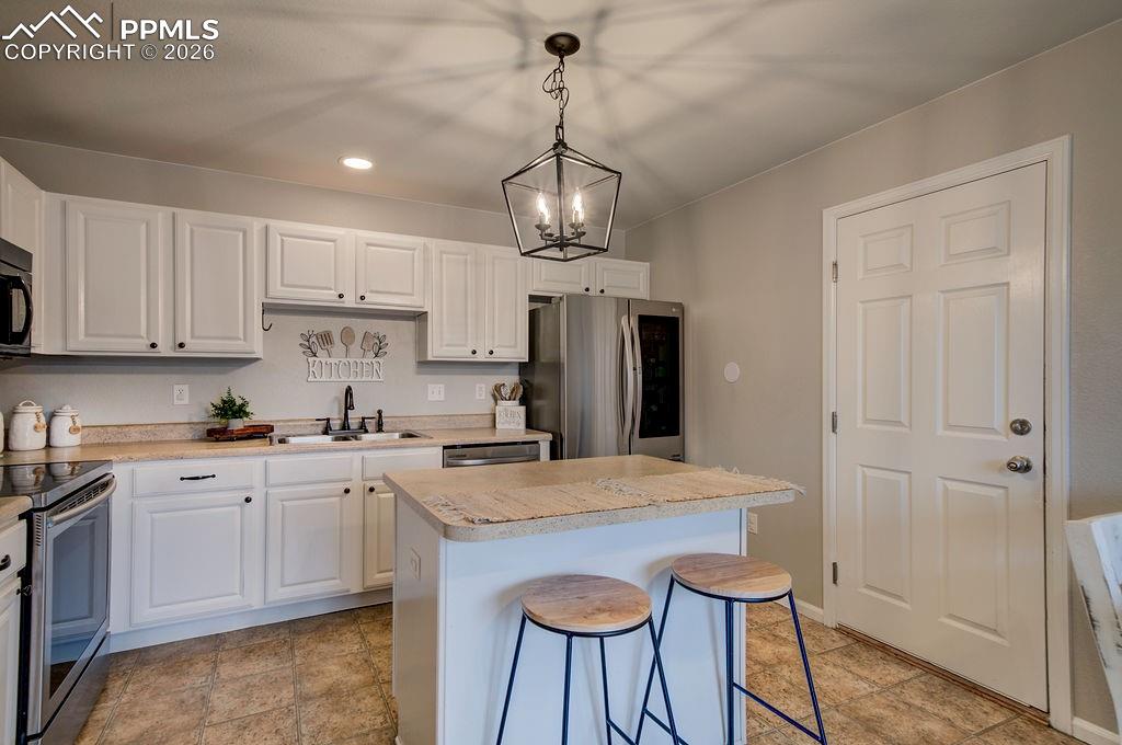 Image 15 of 48: the breakfast bar is perfect for sipping your morning coffee and chats with