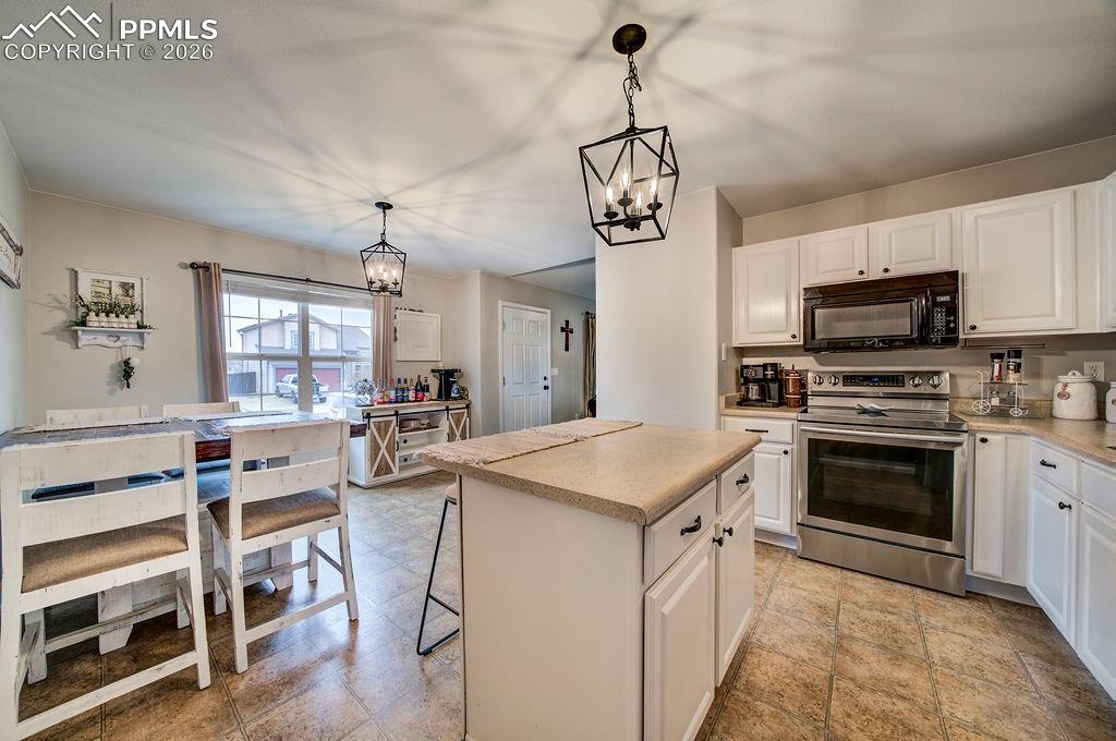 Image 19 of 48: View of the Entry from the Kitchen.