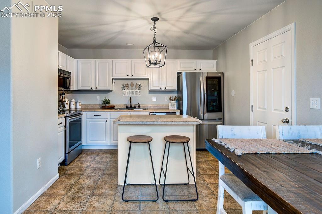 Image 21 of 48: View of the Kitchen from the Dining Area.