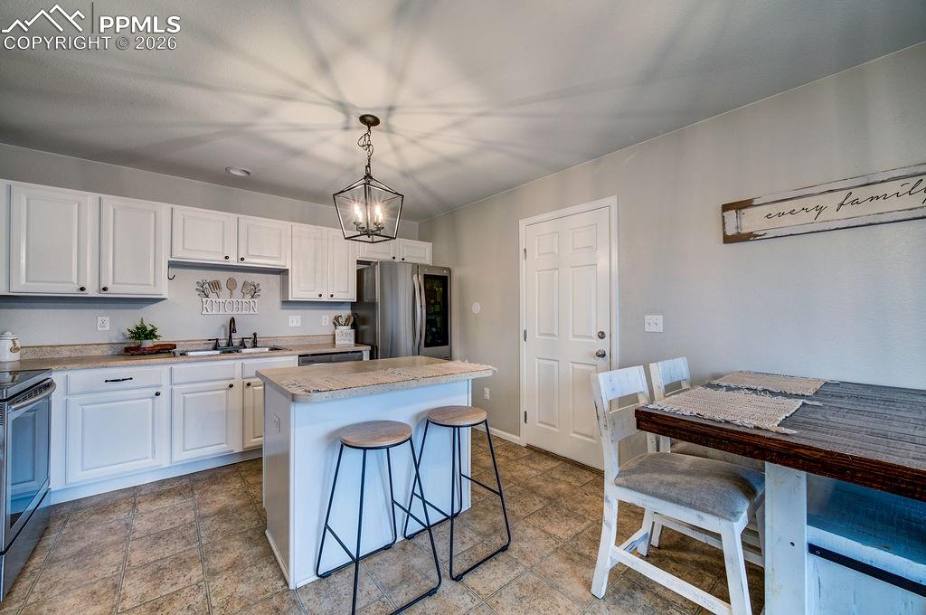 Image 22 of 48: Access to the garage from the kitchen.