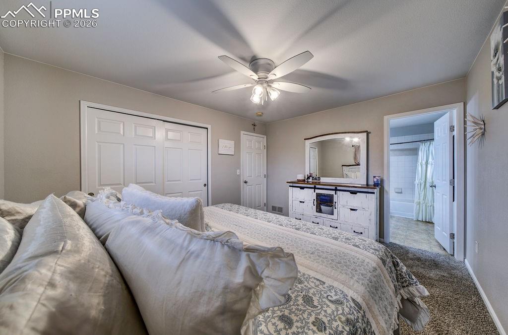 Image 28 of 48: Primary Bedroom into the Full Primary Bathroom.