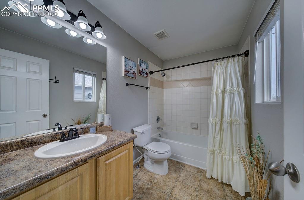 Image 29 of 48: The Primary Bathroom offers a vanity, mirror, and tub/shower.