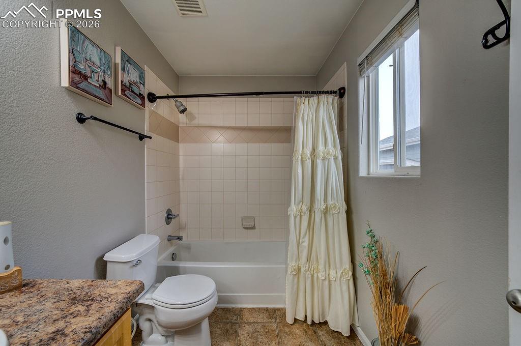 Image 30 of 48: Tub/shower in the Primary Bathroom.