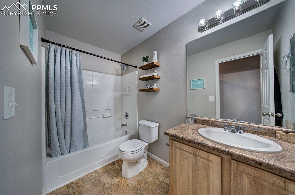 Image 37 of 48: Full Hall Bathroom with vanity, mirror, and