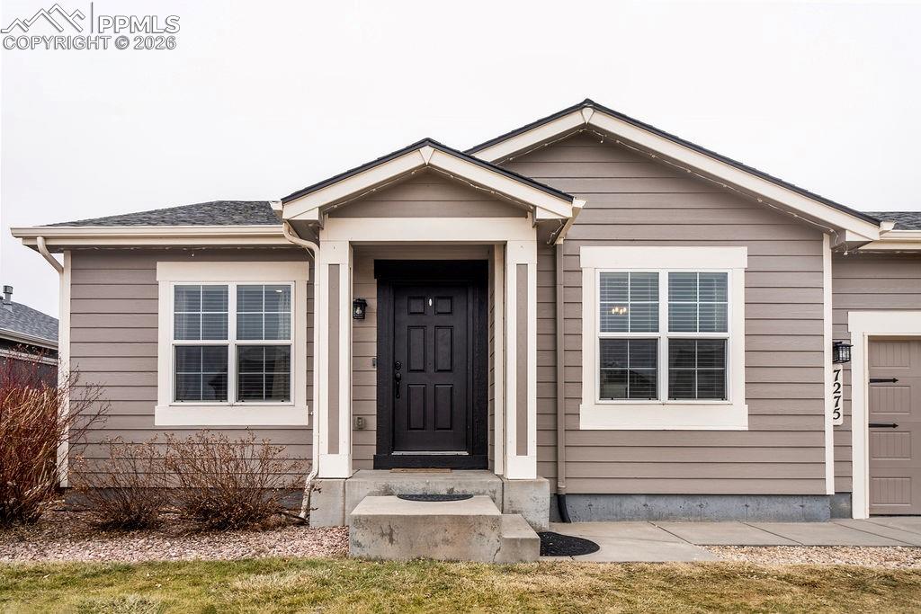 Image 4 of 48: Front walkway and covered front porch.