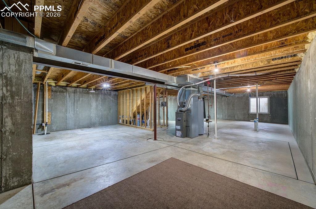 Image 42 of 48: Endless potential to expand your living space in the 1242 sf unfinished bas