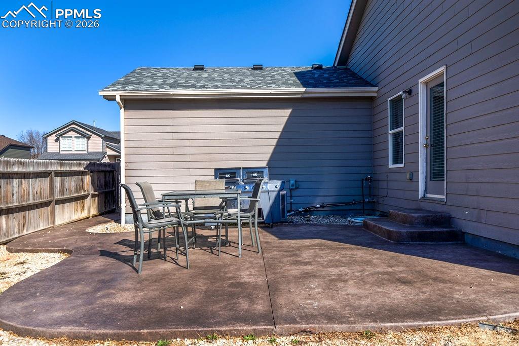 Image 44 of 48: Backyard patio for outdoor dining and relaxation.